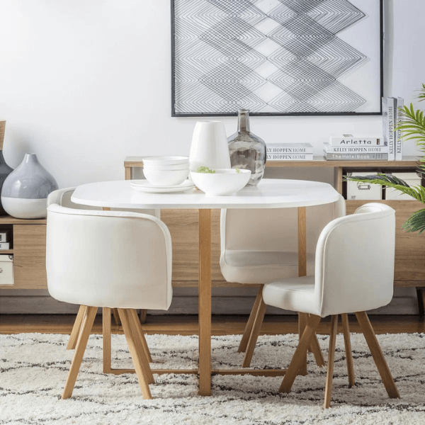 Conjunto de jantar redondo com mesa e quatro cadeiras estofadas